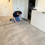 "Colorado Carpet Masters technician carpet stretching loose carpets."